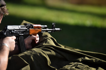 Outdoor target shooting with assault rifle