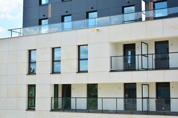 Multistory new modern apartment building. Stylish living block of flats.