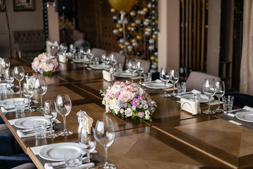 Wedding Banquet or gala dinner. The chairs and table for guests, served with cutlery and crockery.