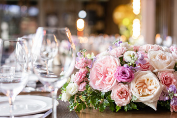 Wedding Banquet or gala dinner. The chairs and table for guests, served with cutlery and crockery.