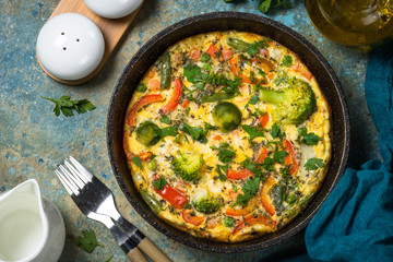 Frittata with fresh vegetables in the skillet.