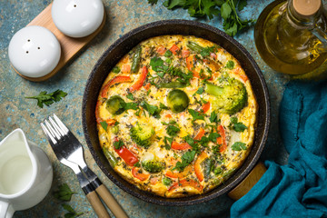 Frittata with fresh vegetables in the skillet.