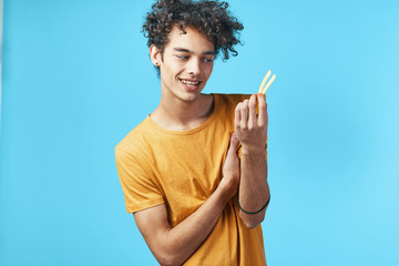 portrait of young man with book on his head