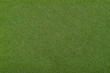 An artificial grass background, top view