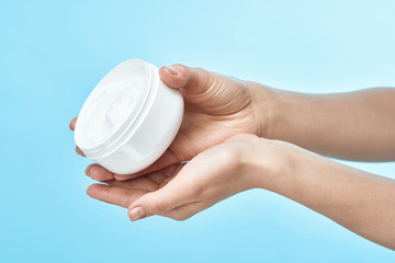 hand with cream isolated on white background