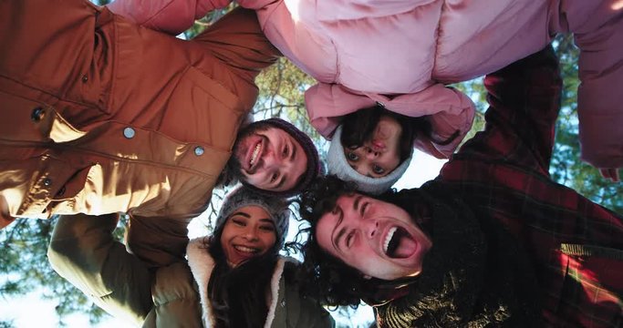 Multi ethnic gorgeous group of friends enjoying the time take the video camera and make a funny video selfies make a circle and capturing all friends together