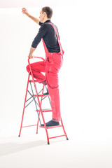 Professional handyman with construction tools. House renovation.