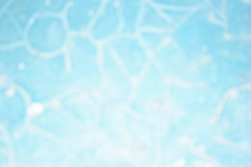 Blue background pattern blurred.