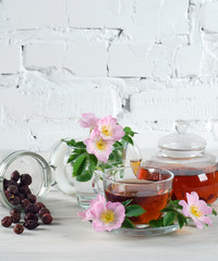 Teapot and cup of rose hip tea