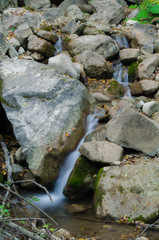 Fototapeta na wymiar water seeps between the rocks