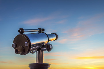 Fototapeta na wymiar Monocular telescope at sunset