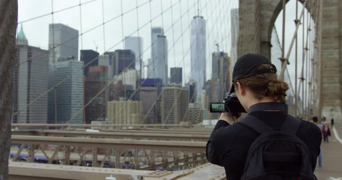 Handsome Male Model Photographing Beautiful Brooklyn Bridge And Iconic New York Skyline With Incredible NYC Skyscrapers