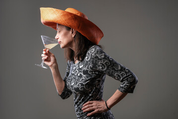 Cheerful older lady with tasty drink