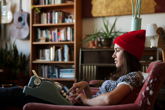 Young woman with typemachine