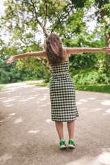 Happiness concept - happy woman having fun outdoors during summer