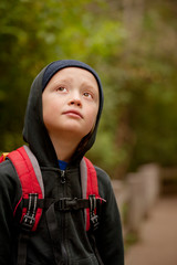 Sad boy (6-7) looking up © Cavan for Adobe