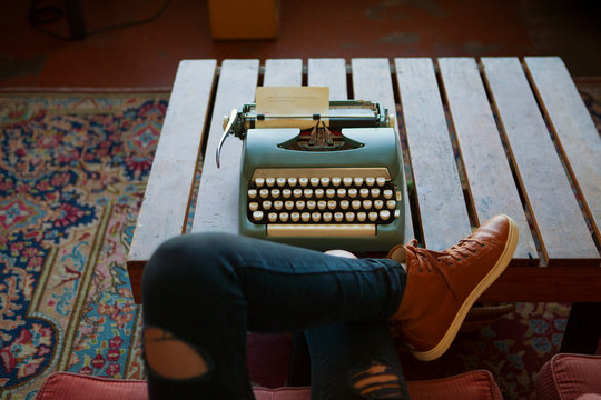 Young woman with typemachine,  low section