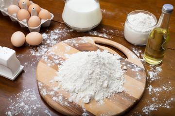 Making dough from eggs and milk. Cooking and home concept