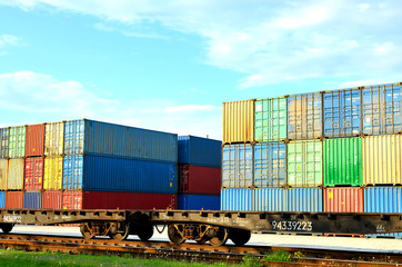 Fototapeta premium Cargo dock terminal with sea containers. logistic warehouse port of shipping container for the subsequent sorting, loading and sending them on freight railway cars or trucks to the client - Image