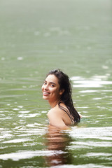 Fototapeta premium Woman swimming in river