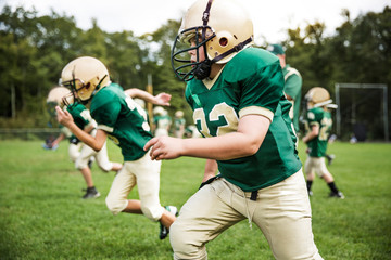 Boys playing American football © Cavan for Adobe