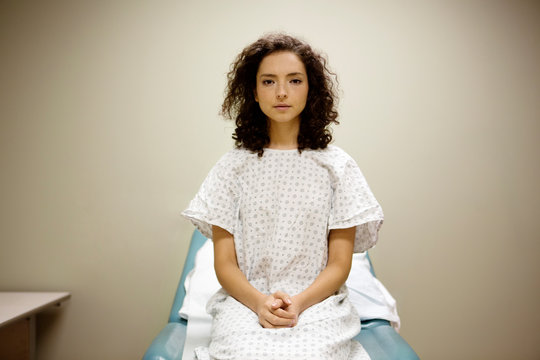 Portrait of patient sitting on hospital bed