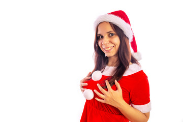 Smiling beautiful young woman in Santa Claus suit is looking at camera on a white background. Merry Christmas and Happy New Year.