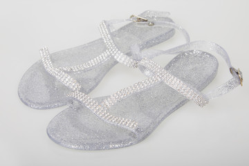 Ladies Classic Transparent Buckled Jelly Shoes.  Clear glitter rubber sandals is known all over the...