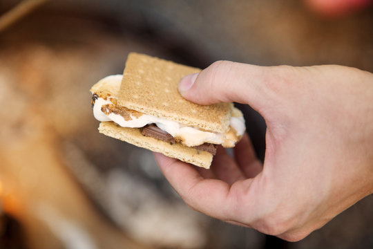Man holding smore in hand