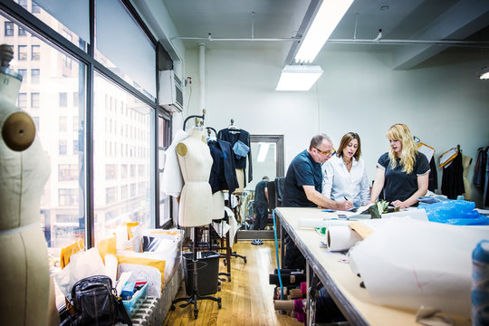 Tailors at work in sewing studio