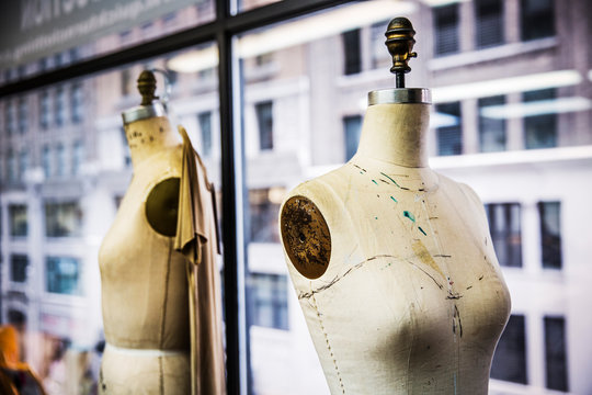 Sewing mannequin against window