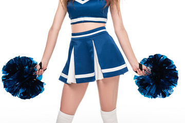 partial view of sexy cheerleader girl in blue uniform with pompoms isolated on white