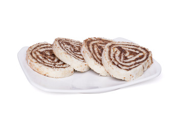 Swiss roll with chocolate filling.  Sponge cake, isolated cutout