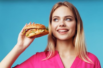 woman with hamburger and french fries