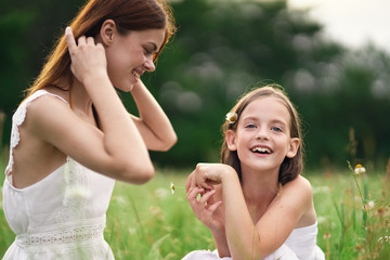 mother and daughter having fun in the park