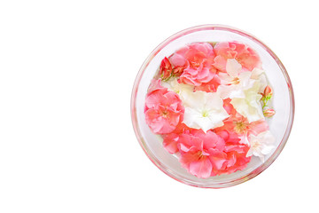 Fototapeta na wymiar Glass plate with water and flowers, spa manicure treatment, top view, spa aroma bowl for hands