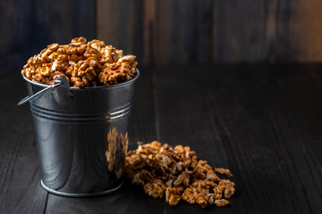 shelled walnuts in a metal bucket