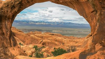 close up shot looking through double o arch in utah