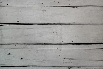 Fototapeta premium Old weathered wooden plank surface painted white. Background texture.