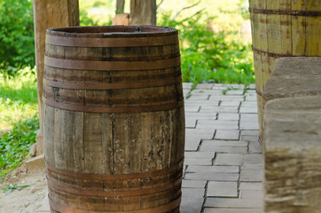 Old dusted wooden barrels used for alcohol 
