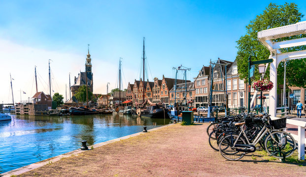 Harbor of Hoorn with the Hoofdtoren, sailboats and city buildings in Netherlands.
