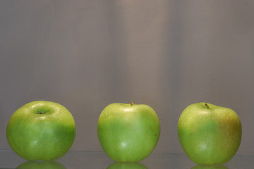 Three green apples