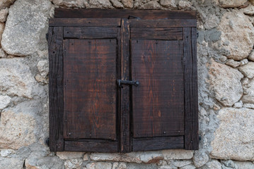 ancient wooden box on stone wall