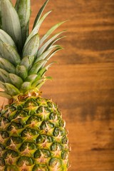 Fototapeta premium Pineapple with wooden background