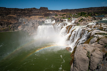 Double rainbow at Shoshone Falls in Twin Falls Idaho on a sunny summer day. This waterfall is considered the Niagara of the West