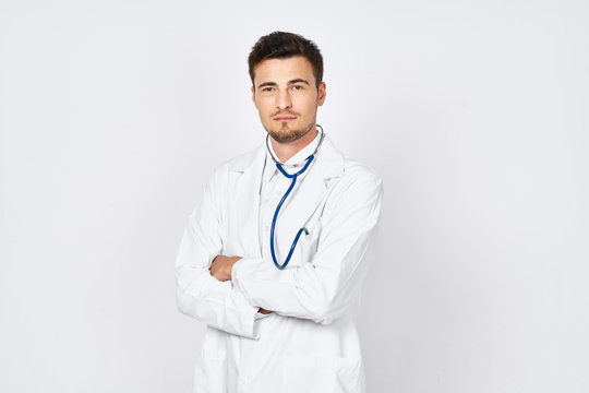 portrait of a young doctor isolated on white background