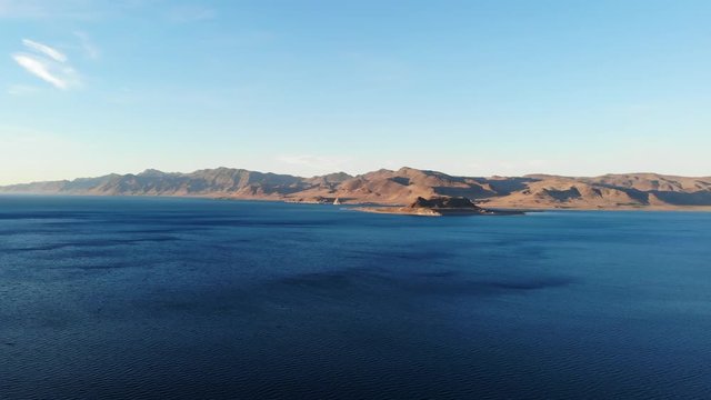 Slow Pull Back of Pyramid Lake Nevada at Sunset over Shore - Aerial Drone.