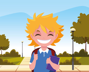 Obraz na płótnie Canvas school boy with bag in the park