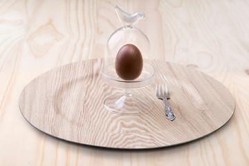 chocolate easter egg on wood