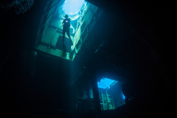 A diver explores the USS Kittiwake, one of the best-known wreck dives in the Caribbean Sea. The...